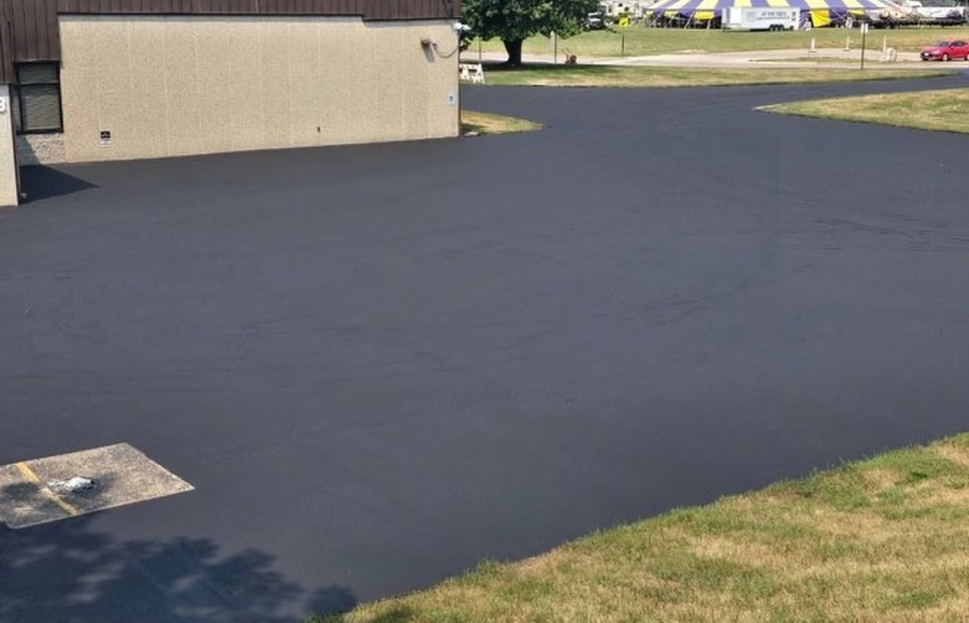 Freshly sealed institutional parking lot